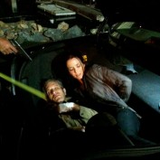Annie Wersching and Jon Sklaroff in trunk of a car