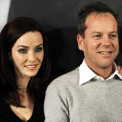 Annie Wersching and Kiefer Sutherland smiling in Munich