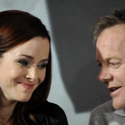 Annie Wersching and Kiefer Sutherland laughing in Munich