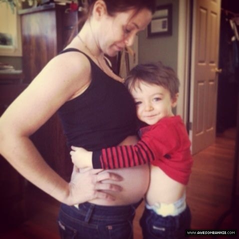 Pregnant Annie Wersching being hugged by son Freddie