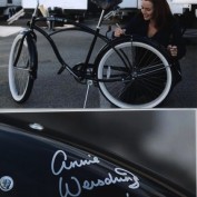 Annie Wersching signing bicycle