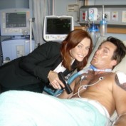 Annie Wersching and Dameon Clarke BTS 24 Hospital set smiling