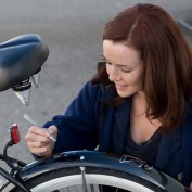 Annie Wersching signs a bike for charity